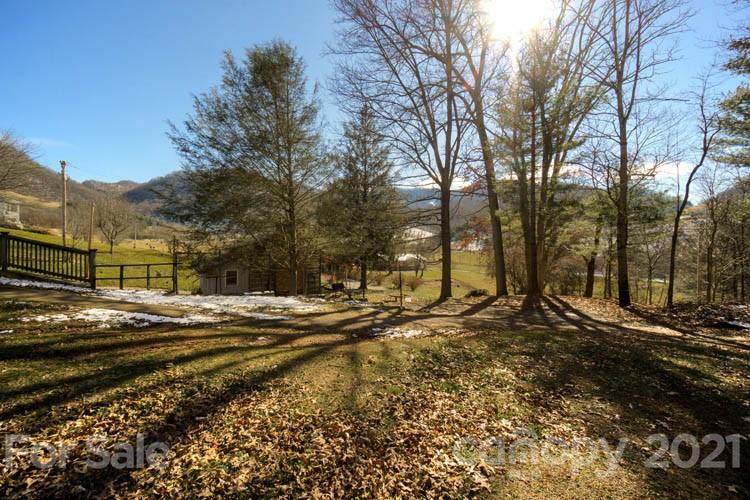 4904 Crabtree Mountain Road Clyde, NC 28721 - Photo 35 of 37 a view of a yard with a street