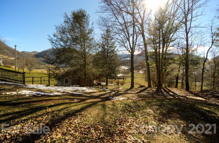 4904 Crabtree Mountain Road Clyde, NC 28721 - Photo 36 of 37 a view of a yard with wooden fence