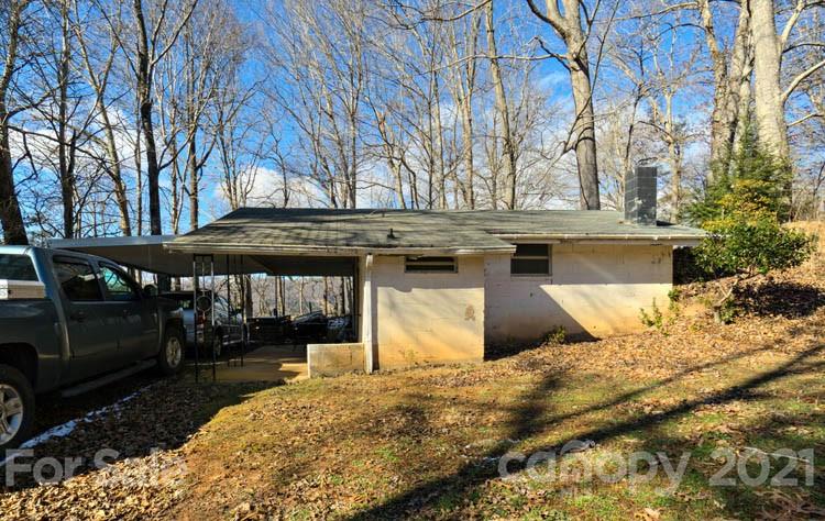 4904 Crabtree Mountain Road Clyde, NC 28721 - Photo 7 of 37 a front view of a house with a yard