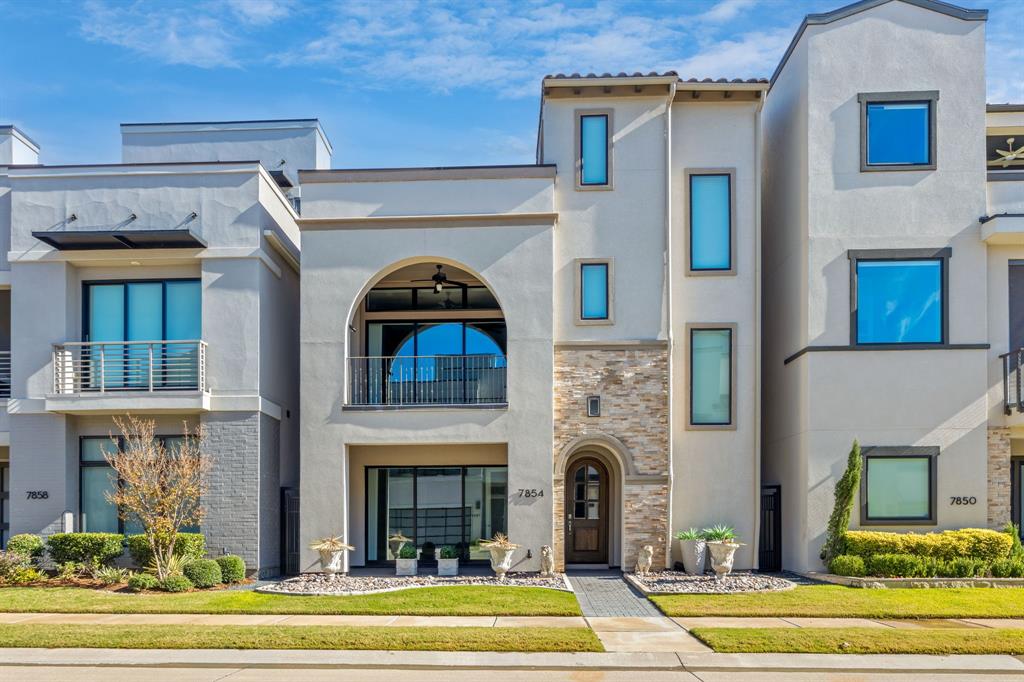 7854 Element Avenue Plano, TX 75024 - Photo 1 of 38 View of front facade featuring a balcony, stucco siding, and a front lawn