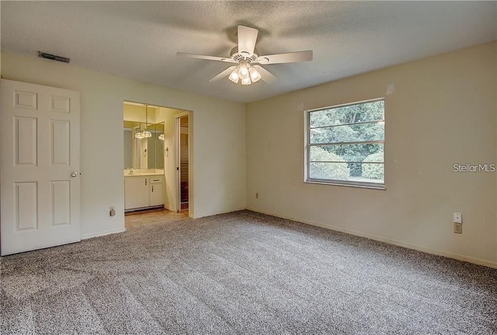 1201 Wolverine Trail Winter Springs, FL 32708 - Photo 14 of 29 an empty room with fan and windows