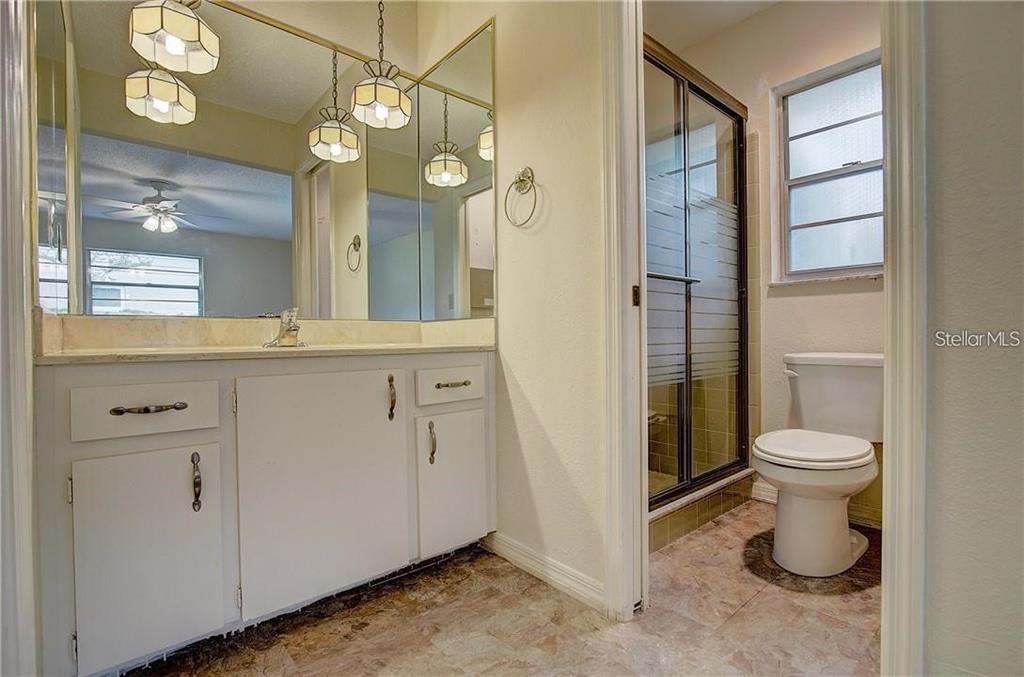 1201 Wolverine Trail Winter Springs, FL 32708 - Photo 16 of 29 a bathroom with a toilet sink and a mirror