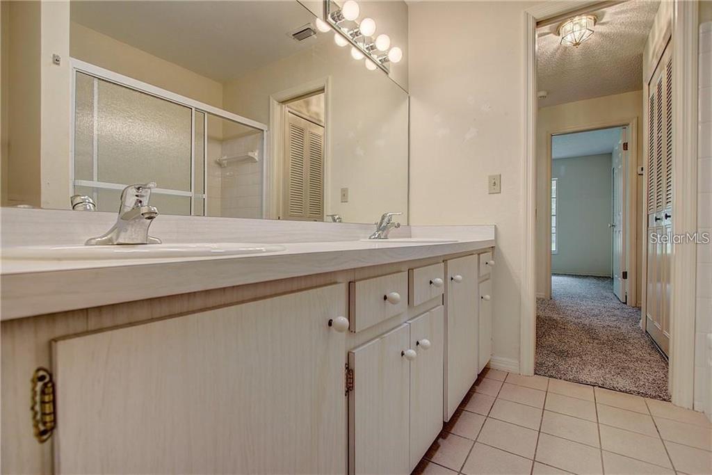 1201 Wolverine Trail Winter Springs, FL 32708 - Photo 22 of 29 a spacious bathroom with a double vanity sink mirror and shower