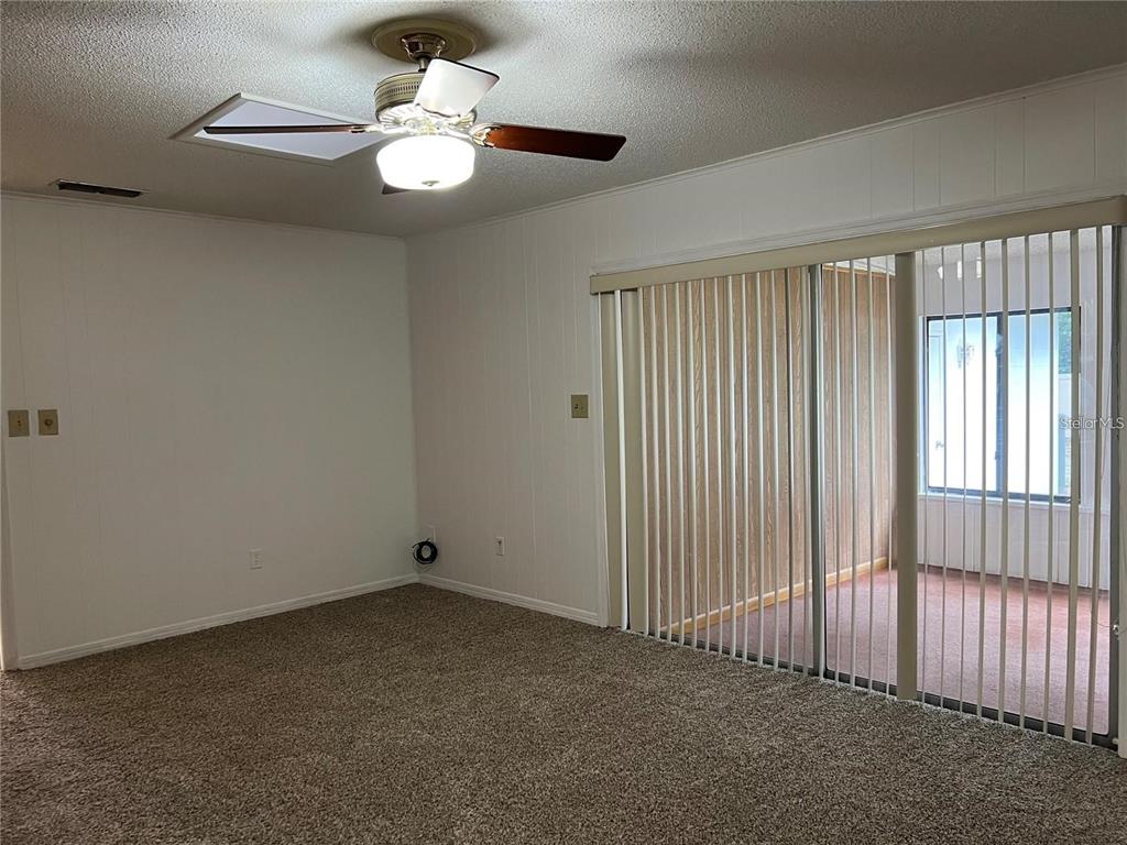 1201 Wolverine Trail Winter Springs, FL 32708 - Photo 23 of 29 an empty room with a ceiling fan and window