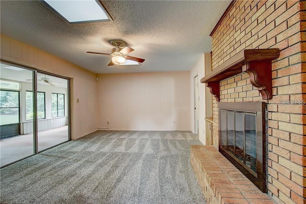 1201 Wolverine Trail Winter Springs, FL 32708 - Photo 10 of 29 wooden floor in an empty room with a window