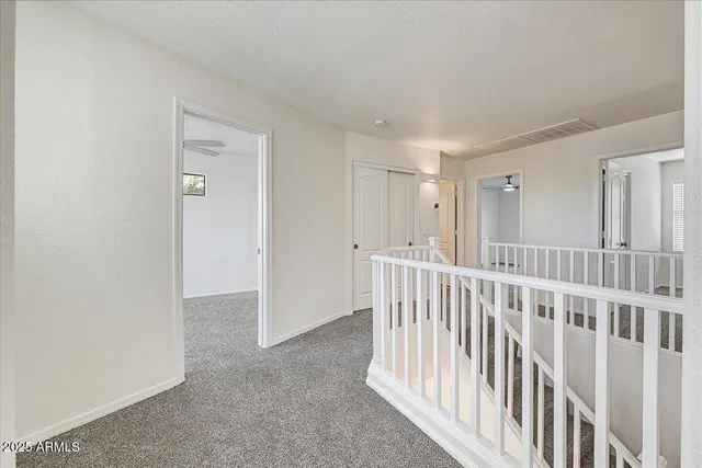 a view of a hallway with a window