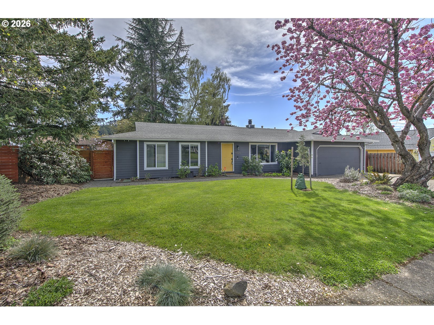 16020 Southwest Rosa Road Beaverton, OR 97007 - Photo 1 of 42 a house view with a garden space