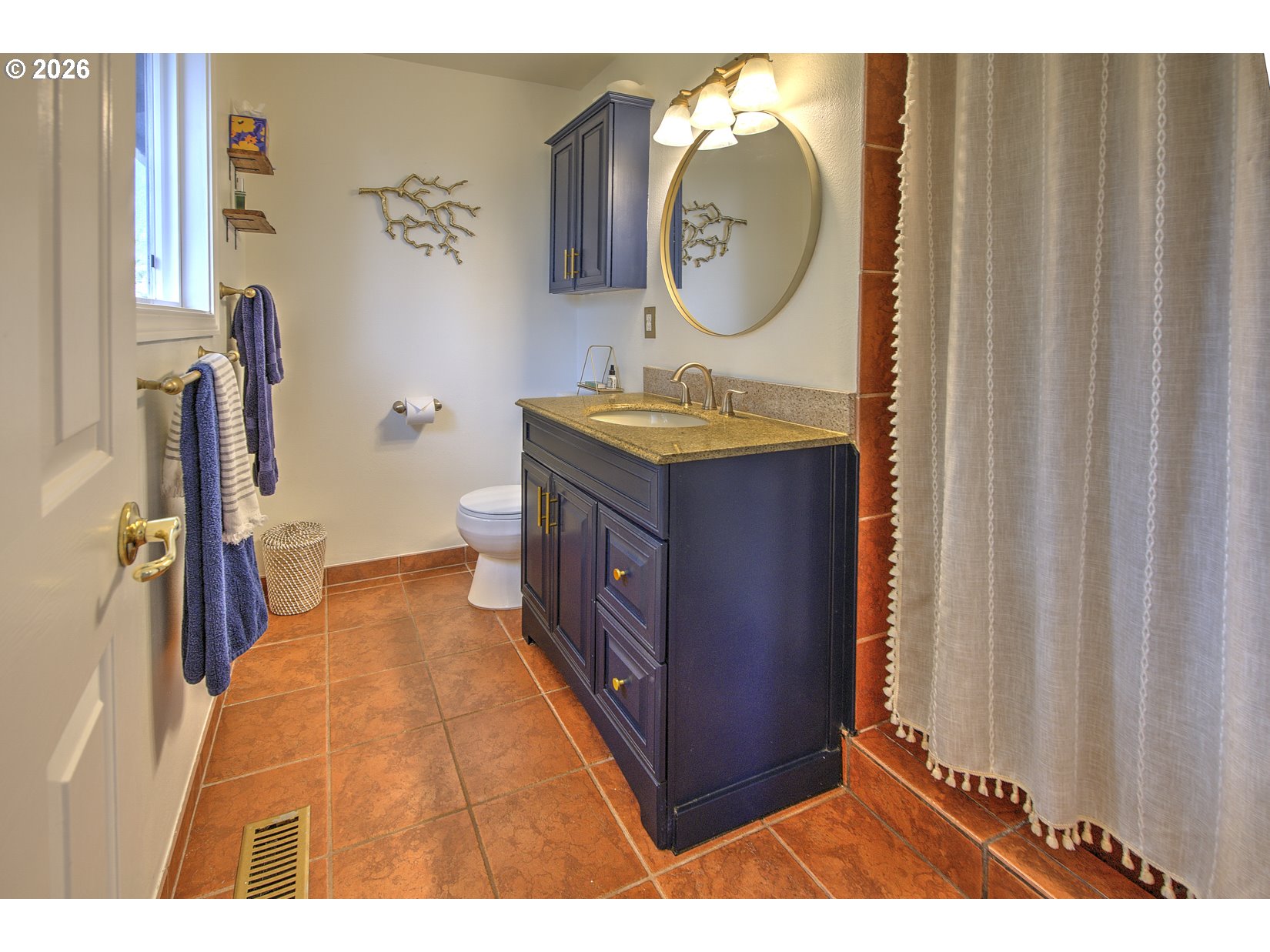 16020 Southwest Rosa Road Beaverton, OR 97007 - Photo 13 of 42 a bathroom with a sink vanity and a mirror