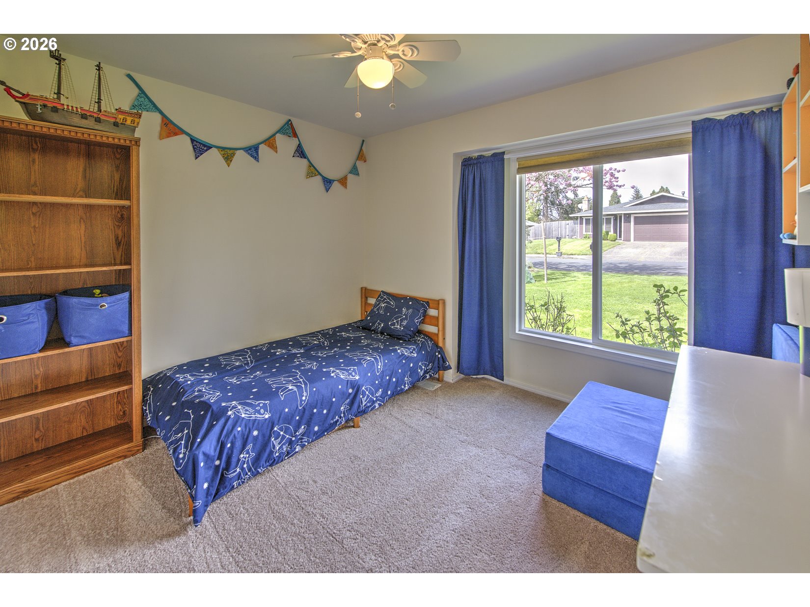 16020 Southwest Rosa Road Beaverton, OR 97007 - Photo 16 of 42 a bedroom with a bed and a window