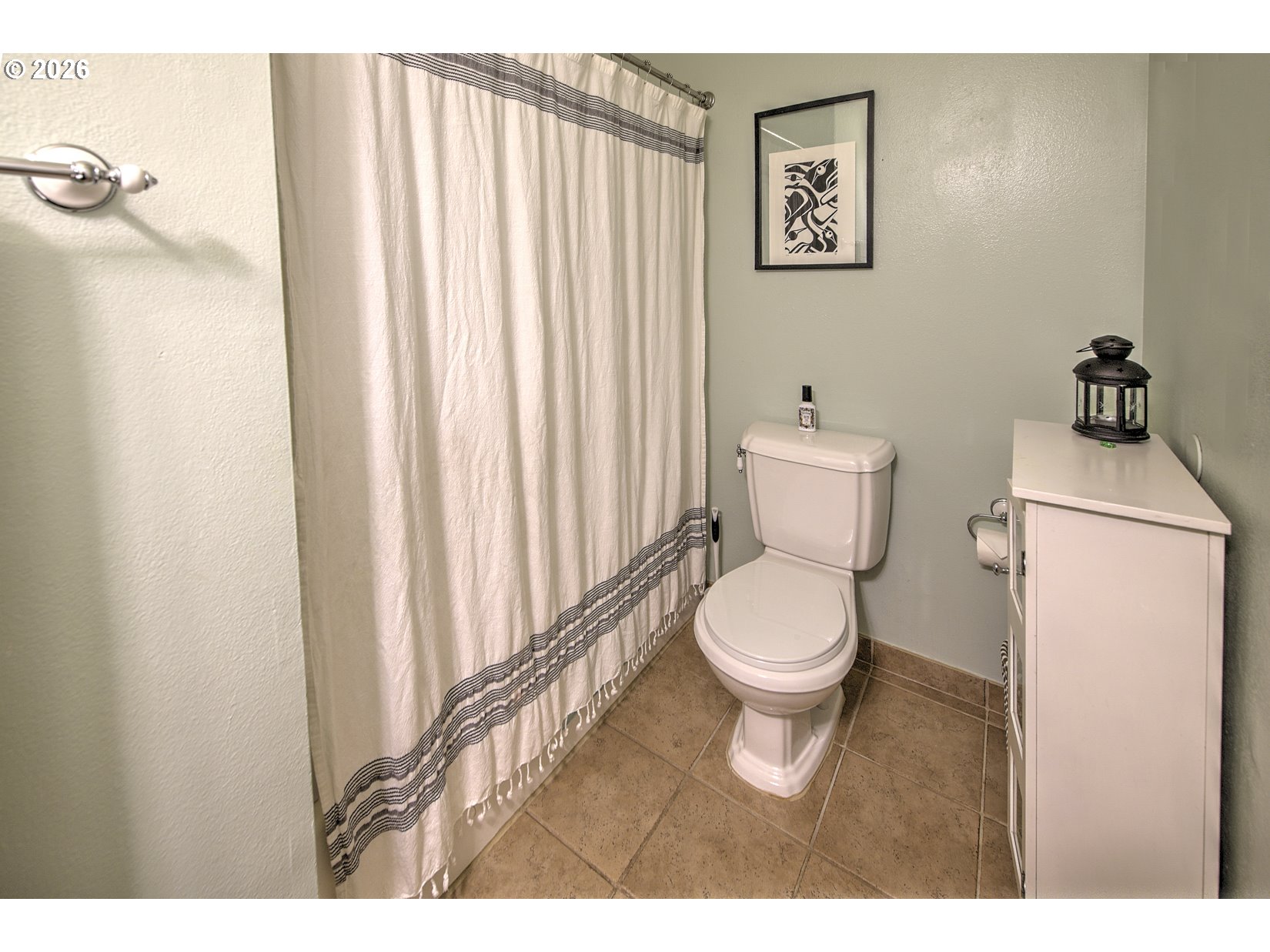 16020 Southwest Rosa Road Beaverton, OR 97007 - Photo 20 of 42 a white toilet sitting next to a bathroom sink