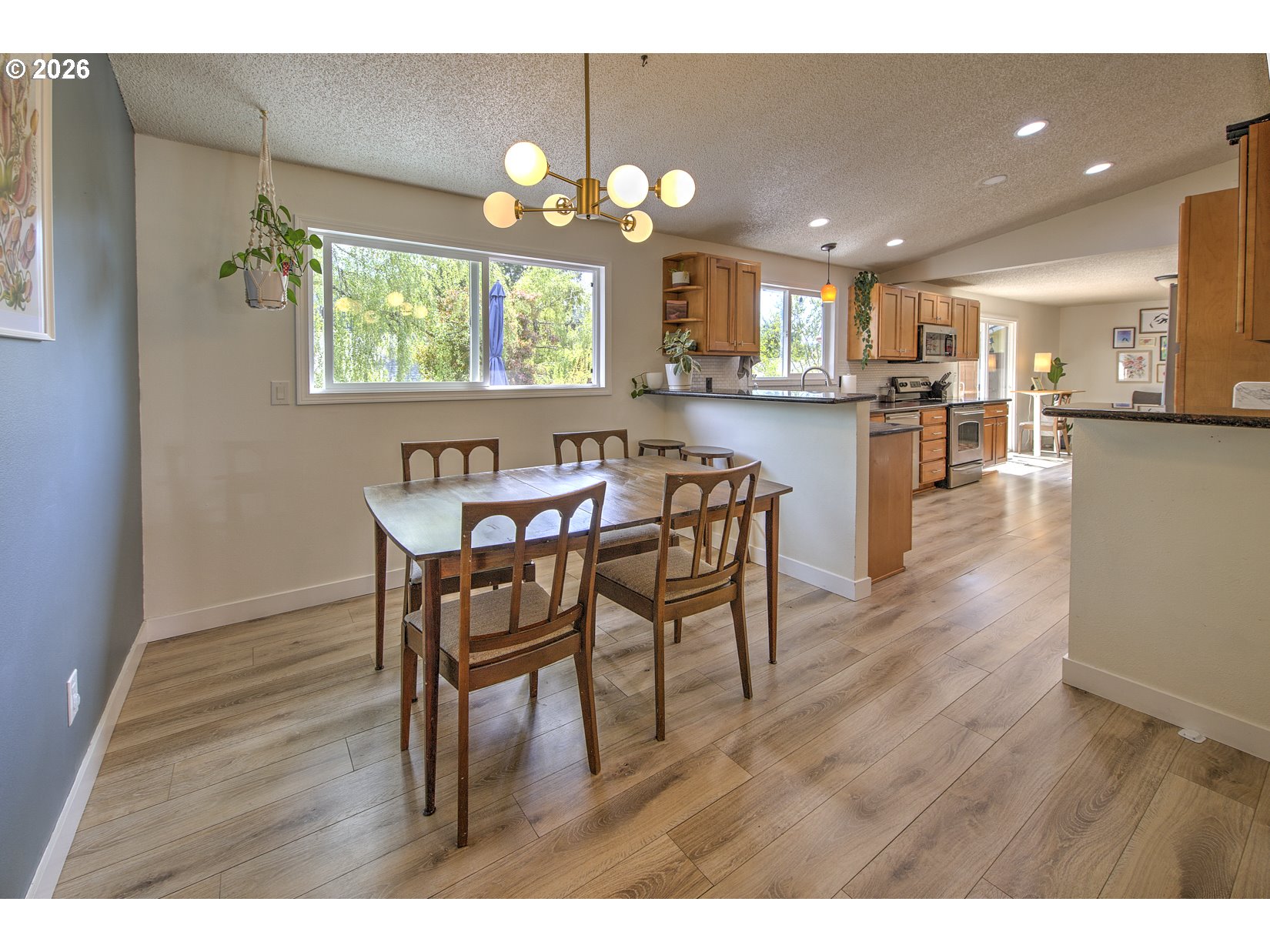 16020 Southwest Rosa Road Beaverton, OR 97007 - Photo 21 of 42 a view of a dining room with furniture and wooden floor