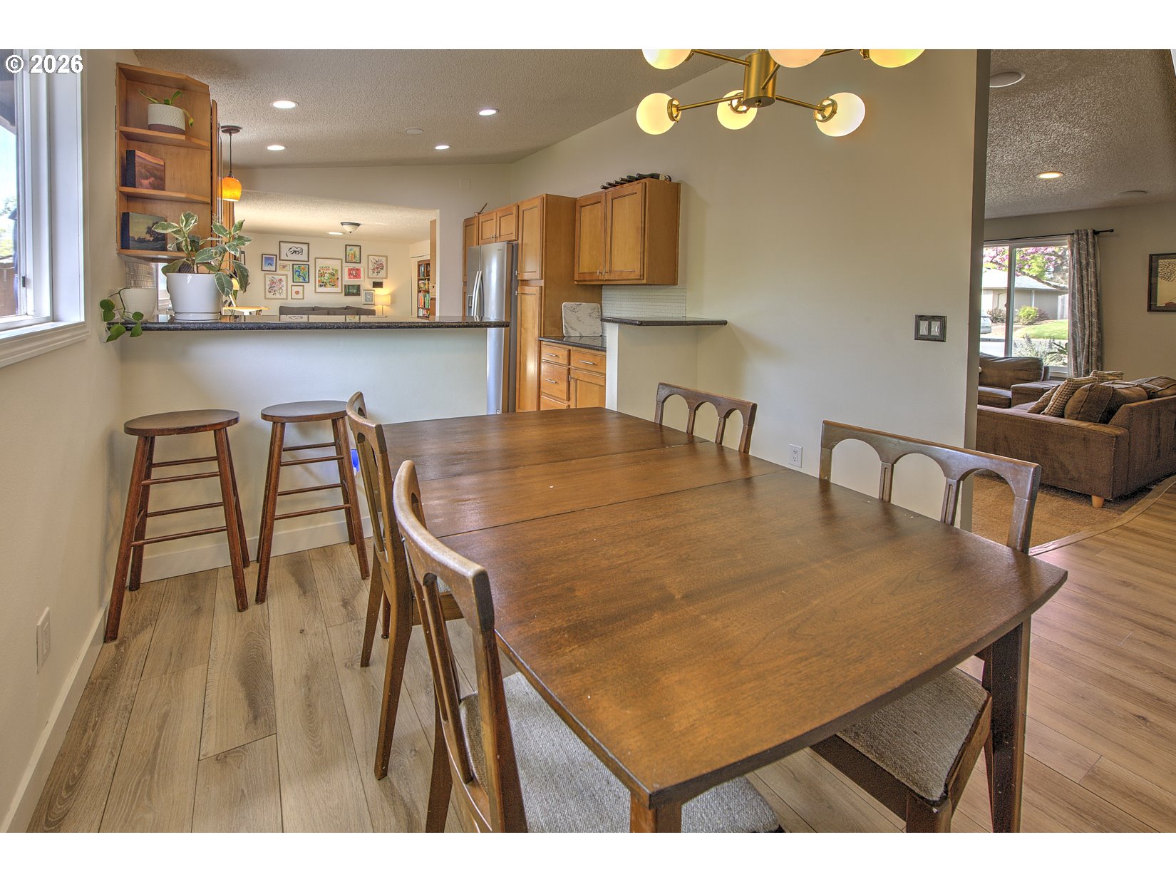 16020 Southwest Rosa Road Beaverton, OR 97007 - Photo 22 of 42 a view of a dining room with furniture and wooden floor