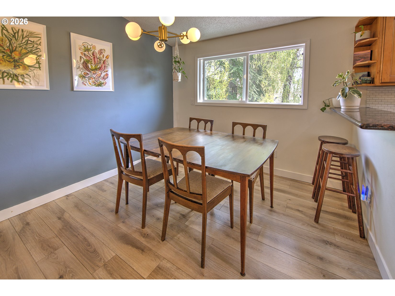 16020 Southwest Rosa Road Beaverton, OR 97007 - Photo 23 of 42 a view of a dining room with furniture and wooden floor