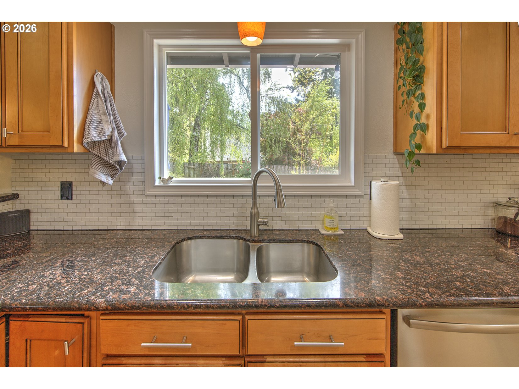 16020 Southwest Rosa Road Beaverton, OR 97007 - Photo 25 of 42 a kitchen with granite countertop a sink and a window
