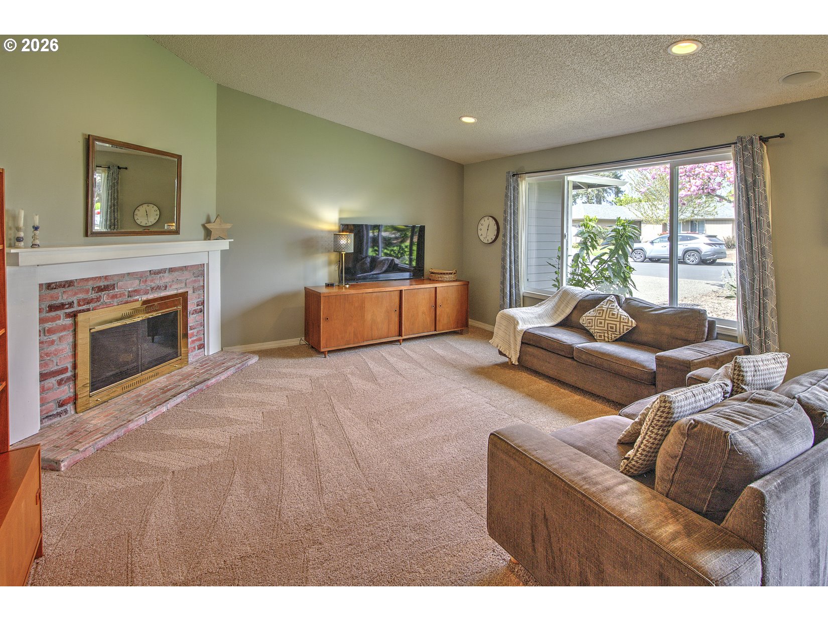 16020 Southwest Rosa Road Beaverton, OR 97007 - Photo 3 of 42 a living room with furniture and a fireplace