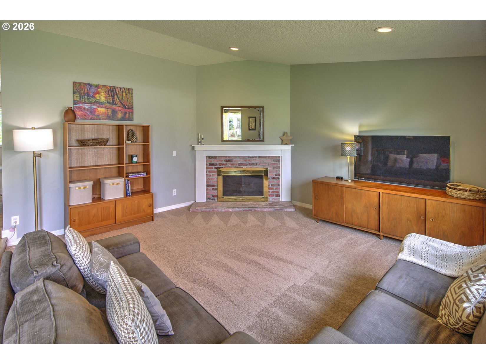 16020 Southwest Rosa Road Beaverton, OR 97007 - Photo 4 of 42 a living room with furniture and a fireplace