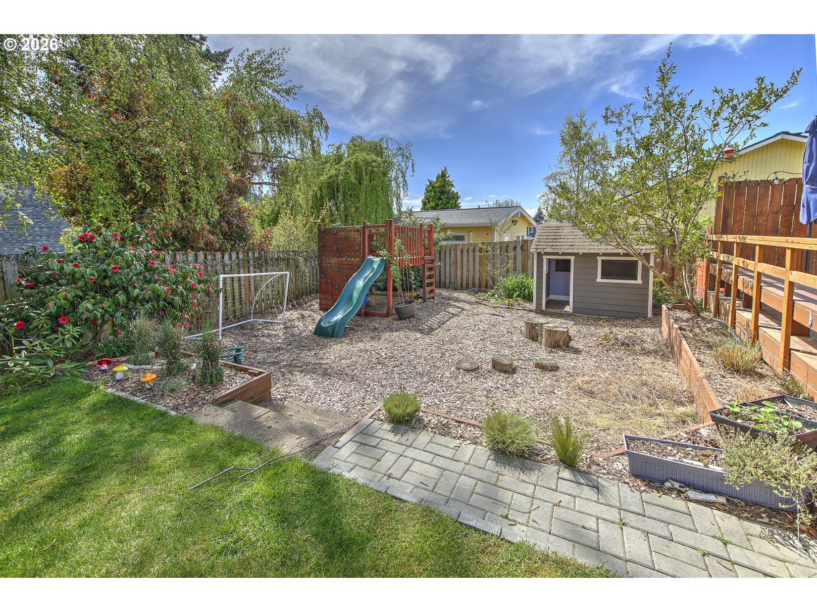 16020 Southwest Rosa Road Beaverton, OR 97007 - Photo 41 of 42 a backyard of a house with table and chairs