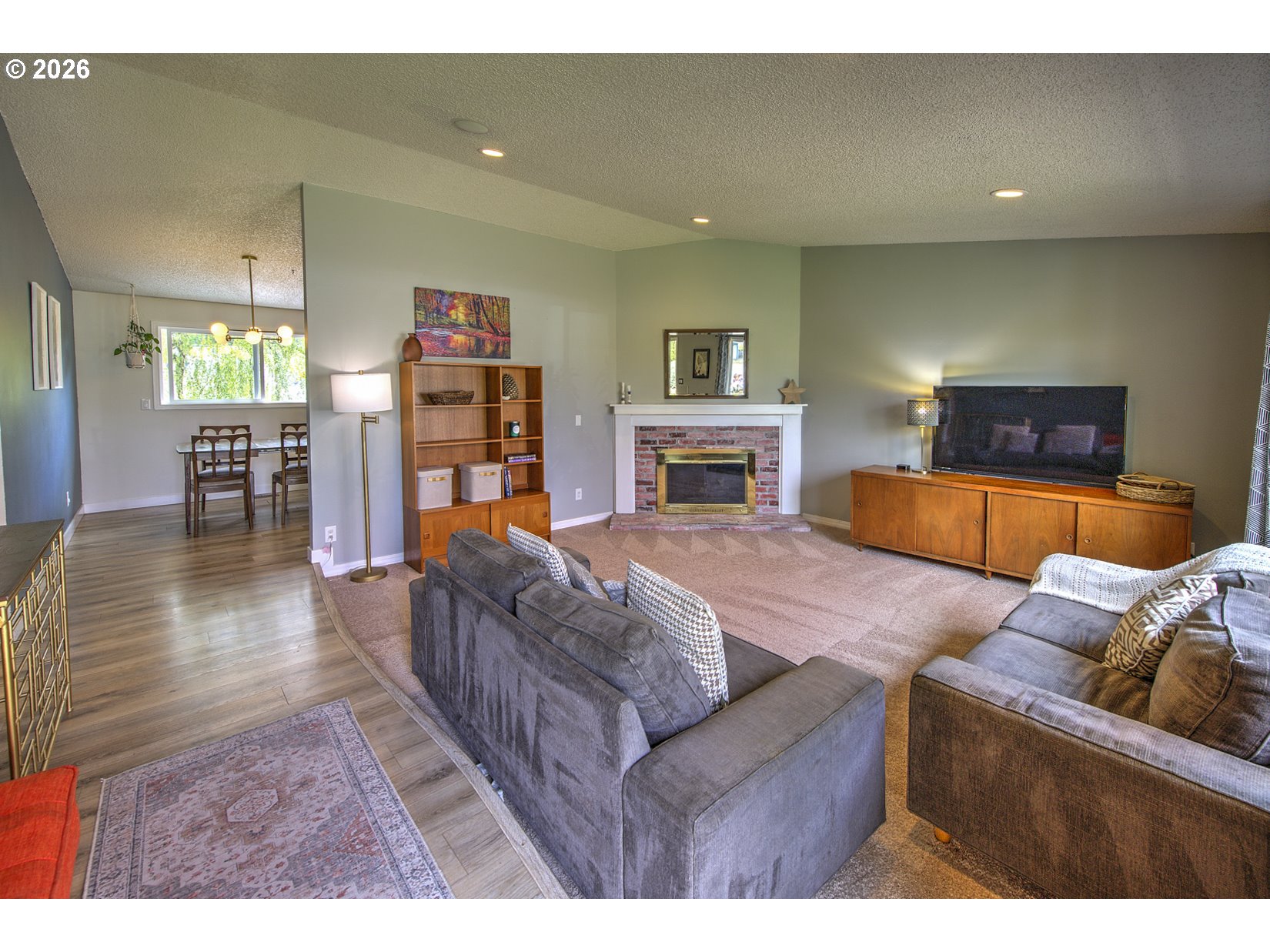 16020 Southwest Rosa Road Beaverton, OR 97007 - Photo 6 of 42 a living room with furniture and a flat screen tv