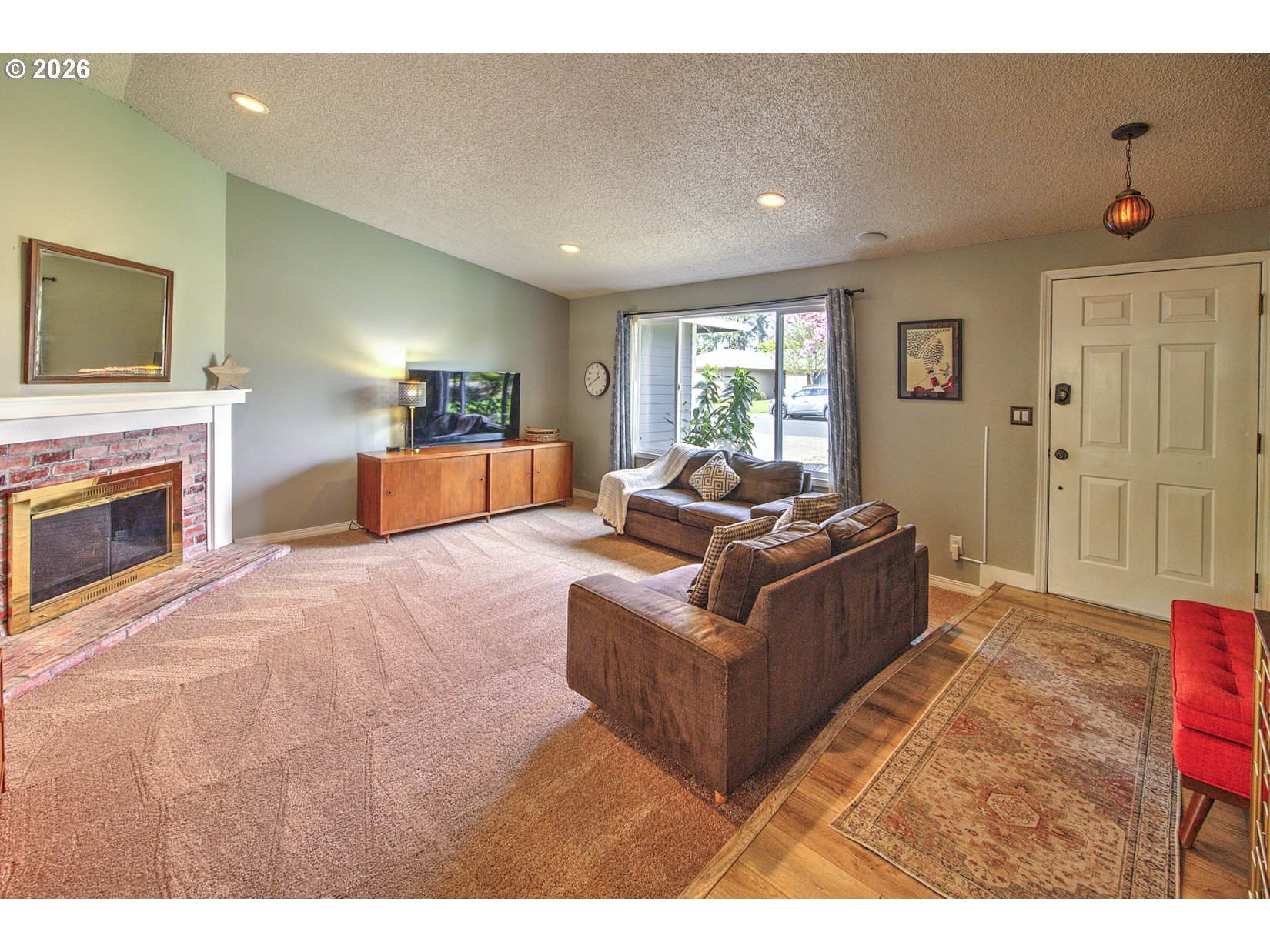 16020 Southwest Rosa Road Beaverton, OR 97007 - Photo 7 of 42 a living room with furniture and a flat screen tv