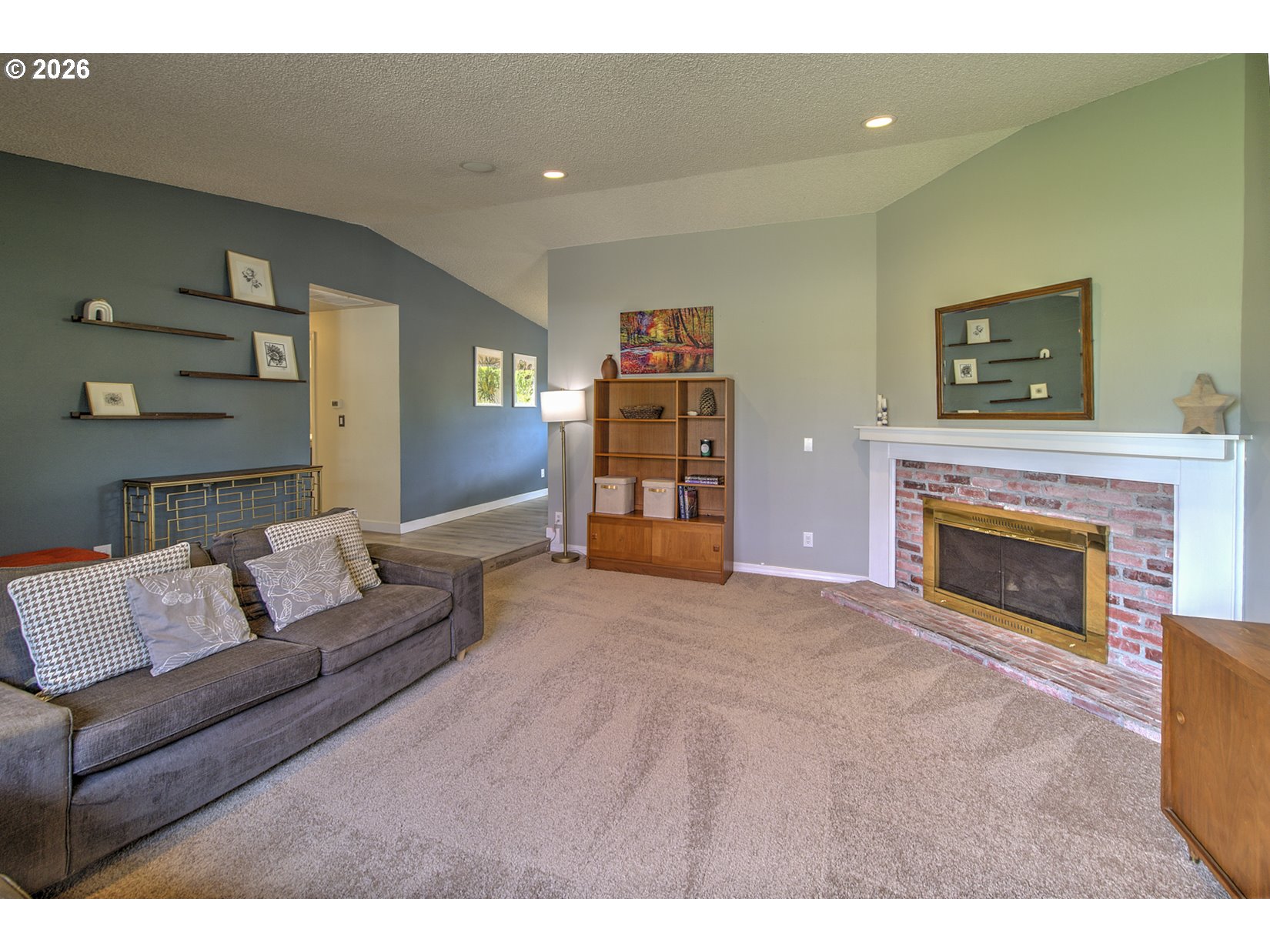16020 Southwest Rosa Road Beaverton, OR 97007 - Photo 9 of 42 a living room with furniture and a fireplace