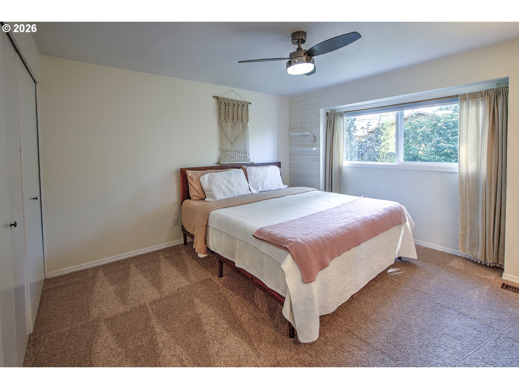 16020 Southwest Rosa Road Beaverton, OR 97007 - Photo 10 of 42 a bedroom with a bed and window