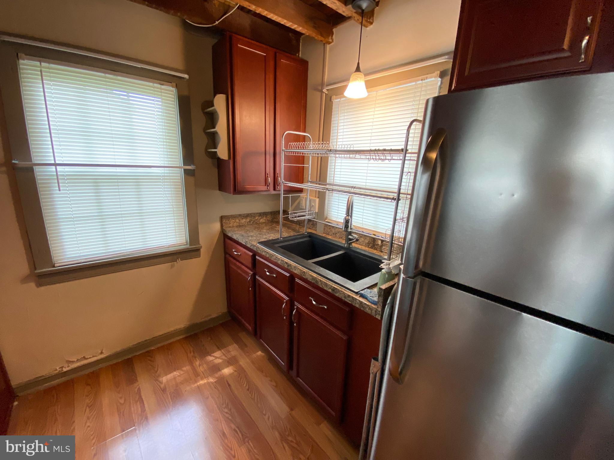 114 North Street Lewisberry, PA 17339 - Photo 4 of 4 a kitchen with stainless steel appliances granite countertop a refrigerator a sink and a stove
