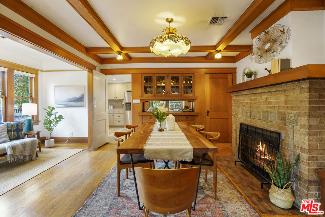 337 Cherry Avenue Long Beach, CA 90802 - Photo 16 of 52 a dining room with furniture a fireplace and wooden floor