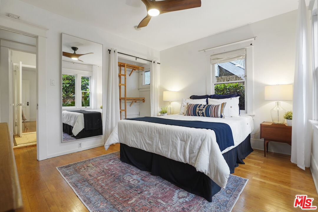 337 Cherry Avenue Long Beach, CA 90802 - Photo 26 of 52 a bedroom with a bed and glass walk in closet