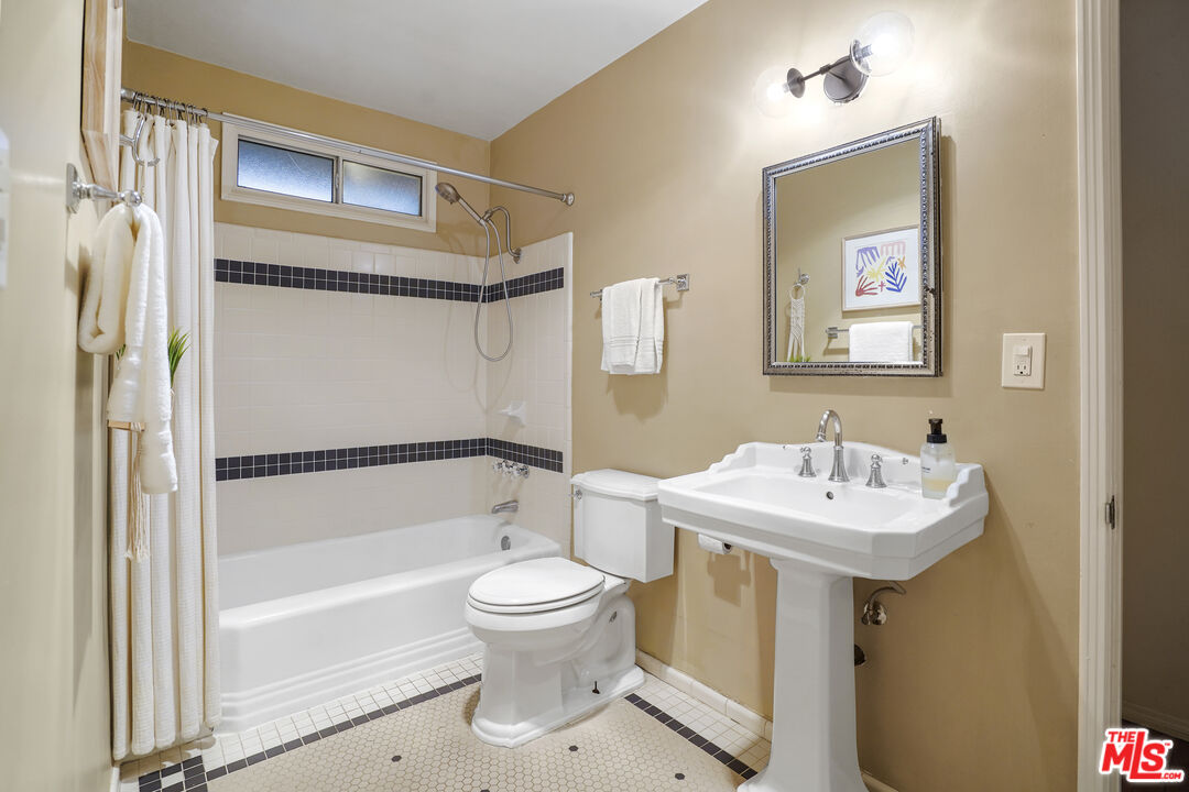 337 Cherry Avenue Long Beach, CA 90802 - Photo 27 of 52 a bathroom with a sink toilet and shower