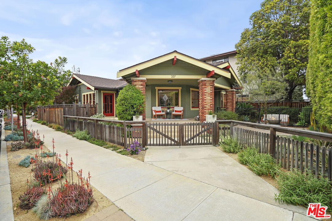 337 Cherry Avenue Long Beach, CA 90802 - Photo 3 of 52 a view of a house with wooden fence next to a yard