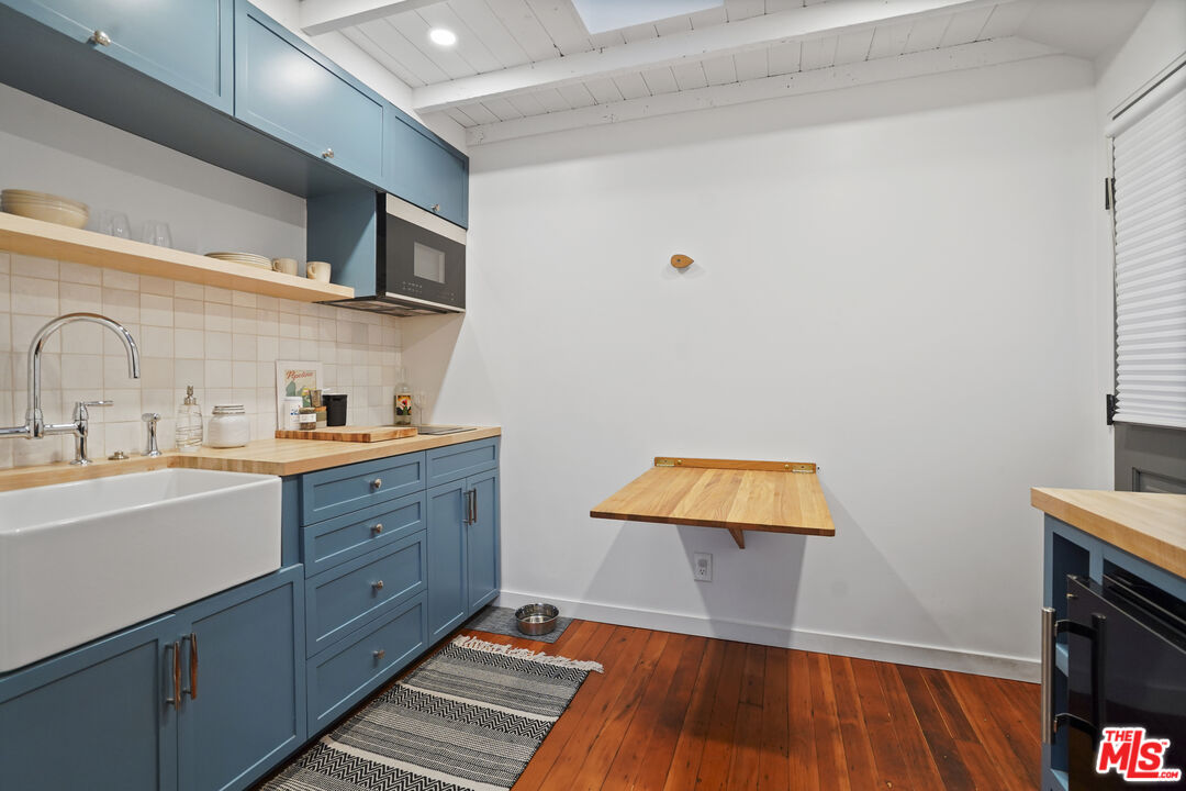 337 Cherry Avenue Long Beach, CA 90802 - Photo 38 of 52 a room with wooden floors and a sink