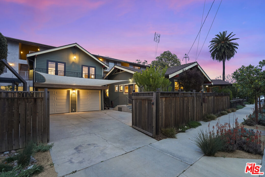 337 Cherry Avenue Long Beach, CA 90802 - Photo 42 of 52 a front view of a house with a yard and garage