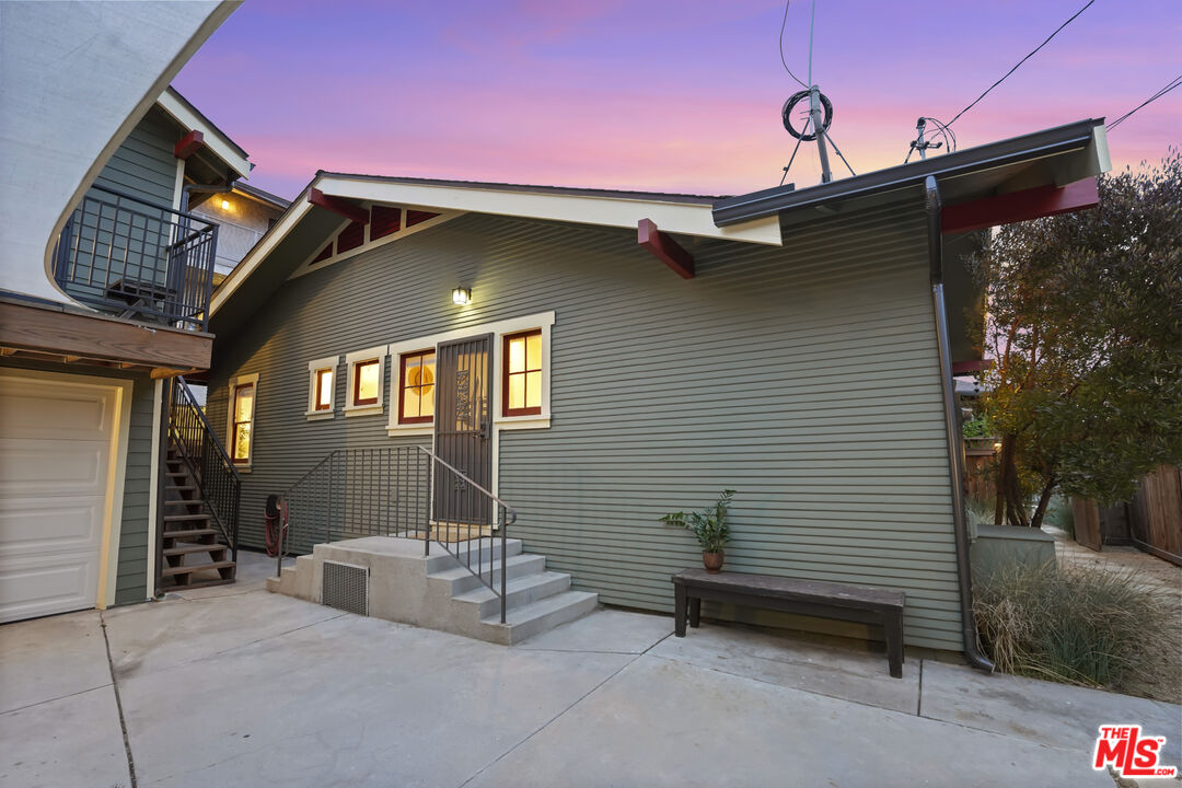 337 Cherry Avenue Long Beach, CA 90802 - Photo 44 of 52 a front view of a house with barbeque grill and wooden fence