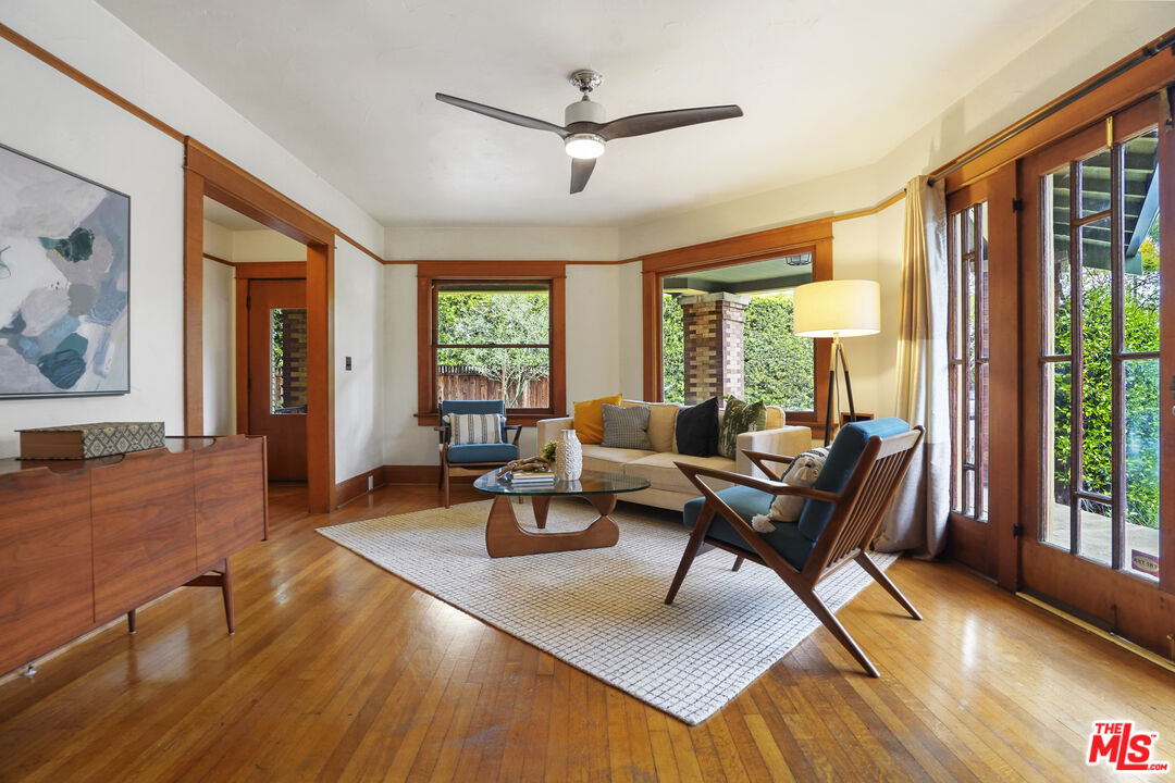 337 Cherry Avenue Long Beach, CA 90802 - Photo 10 of 52 a living room with furniture a large window and wooden floor