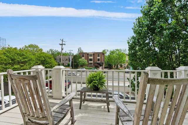 a view of balcony with furniture and wooden deck