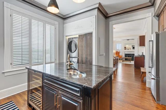 a view of kitchen island with furniture and wooden floor