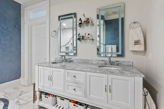 a bathroom with sink and mirror