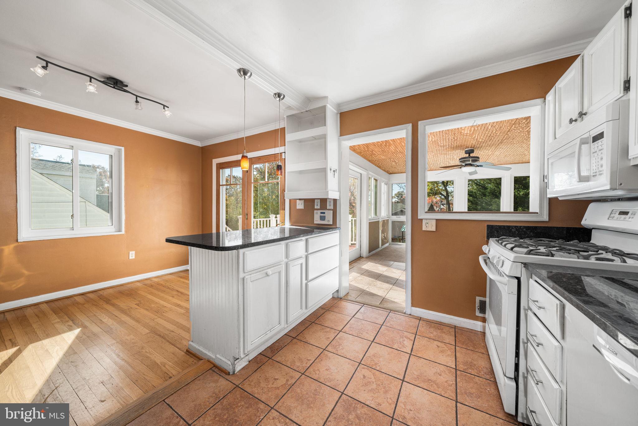3924 Taney Avenue Alexandria, VA 22304 - Photo 15 of 57 a kitchen with stainless steel appliances granite countertop a stove a sink and a refrigerator