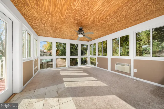 a view of room with window and hardwood floor