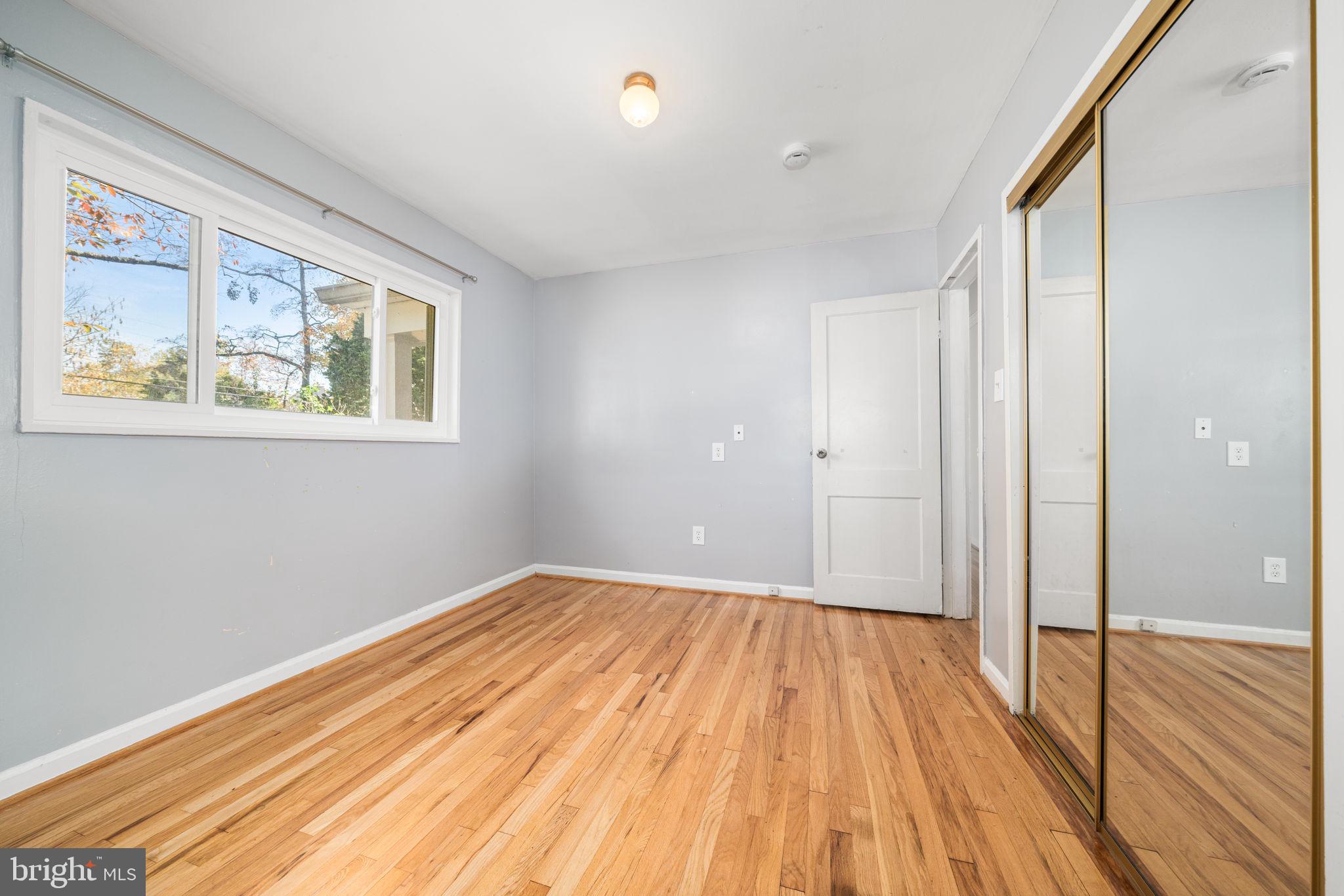 3924 Taney Avenue Alexandria, VA 22304 - Photo 20 of 57 a view of a room with wooden floor and a window