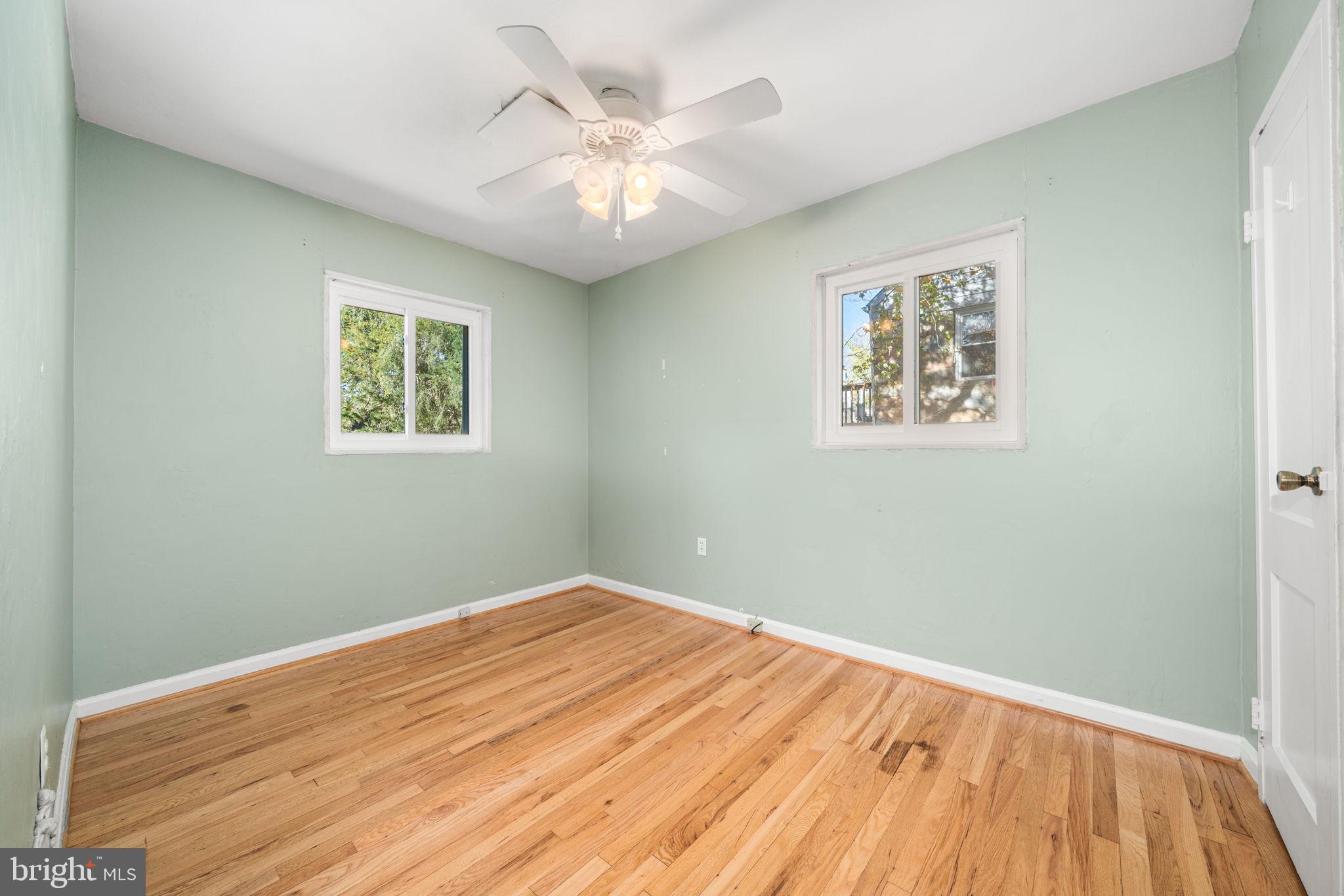 3924 Taney Avenue Alexandria, VA 22304 - Photo 21 of 57 a view of a room with wooden floor and a ceiling fan