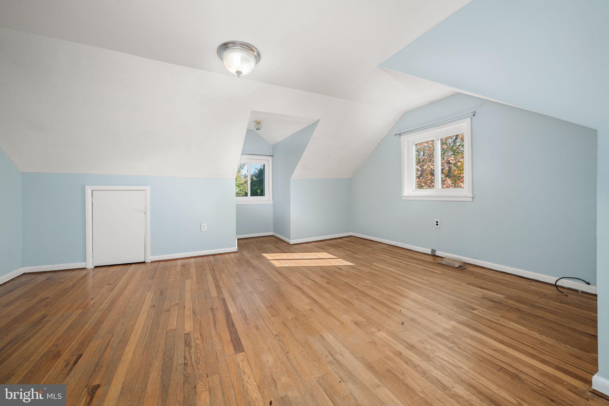 3924 Taney Avenue Alexandria, VA 22304 - Photo 26 of 57 an empty room with wooden floor and windows