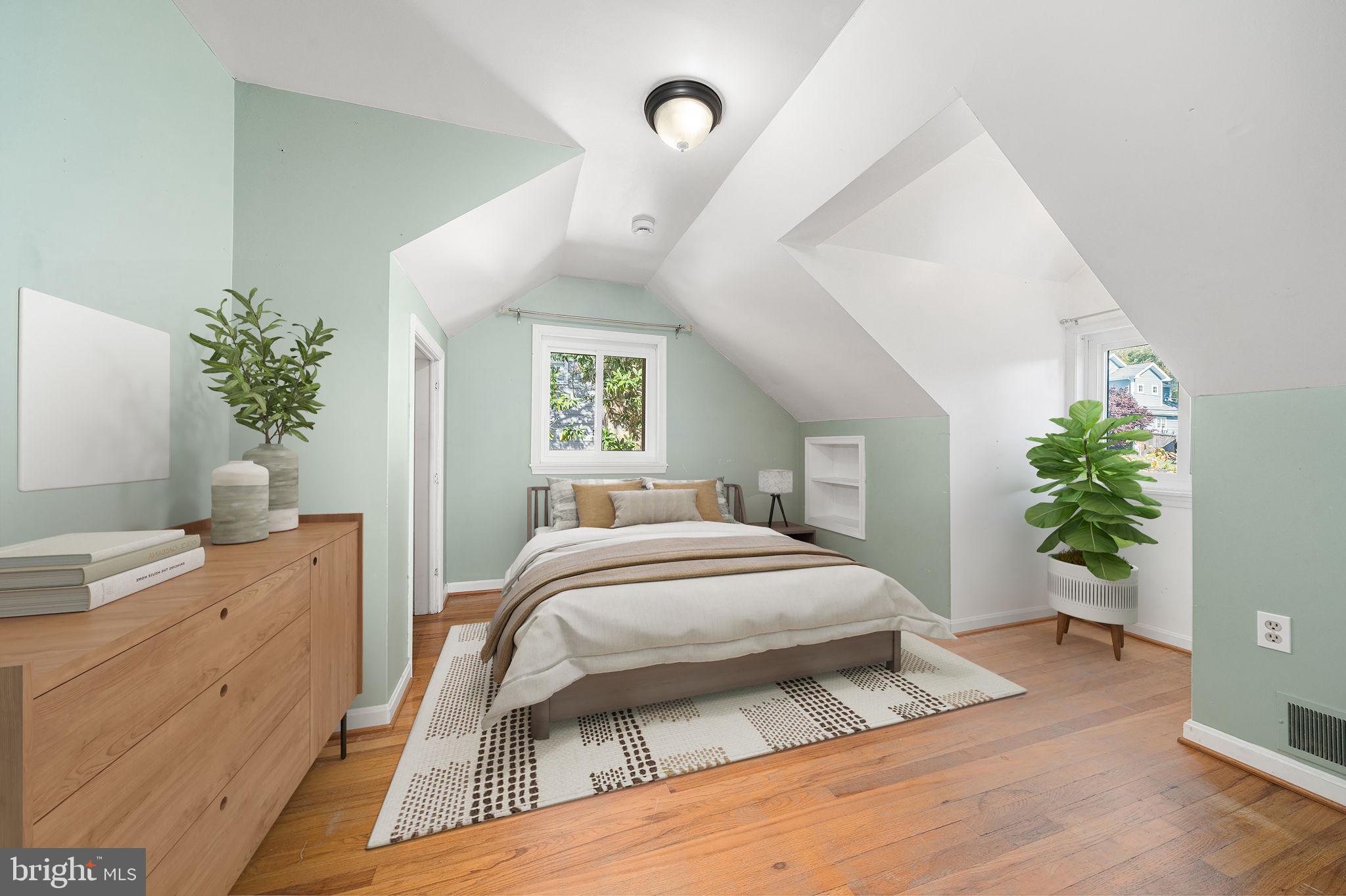 3924 Taney Avenue Alexandria, VA 22304 - Photo 33 of 57 a bedroom with a bed and a potted plant