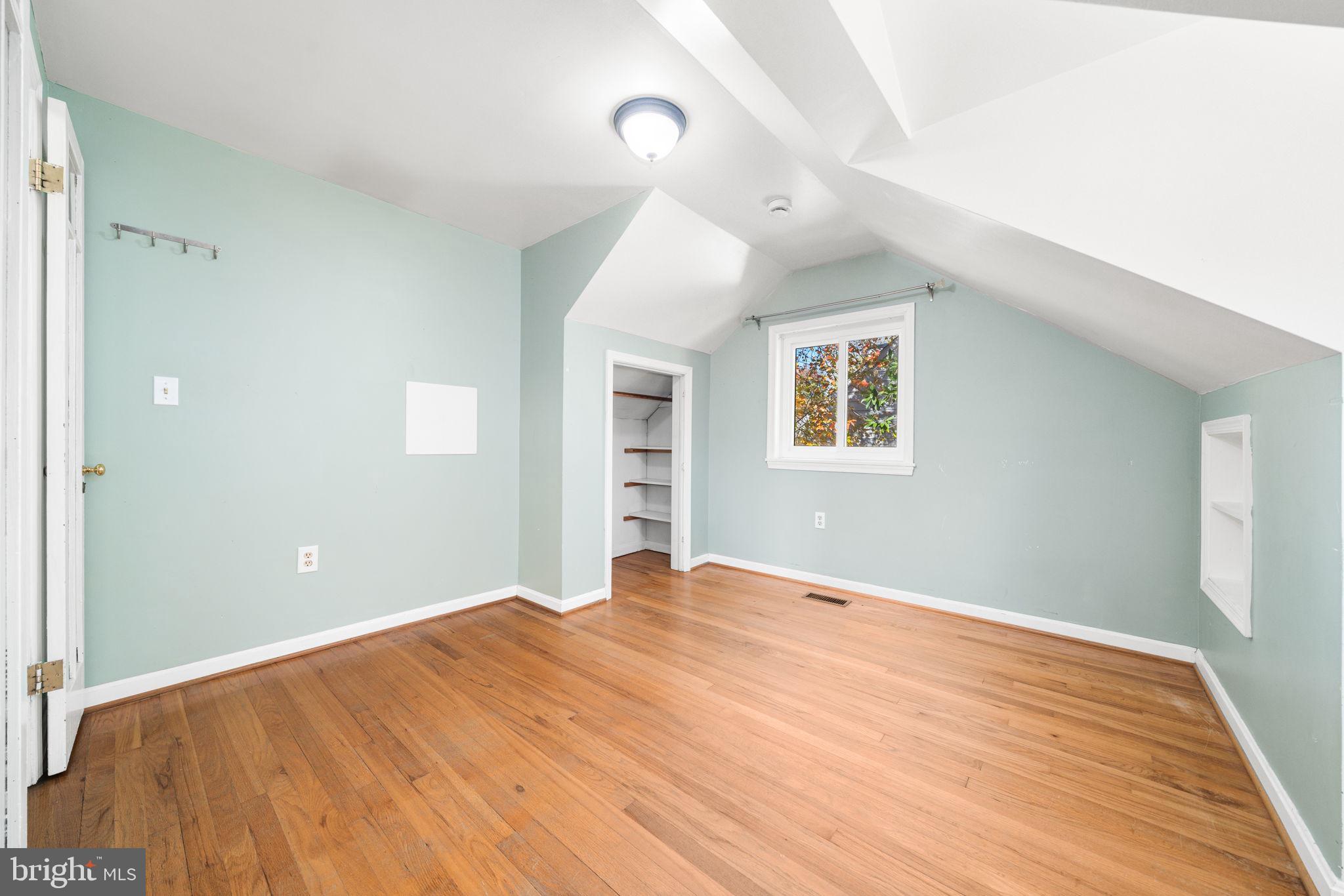 3924 Taney Avenue Alexandria, VA 22304 - Photo 35 of 57 a view of an empty room with wooden floor and a window