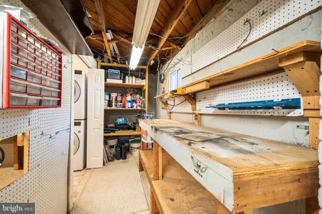 a view of an empty room with a cabinet
