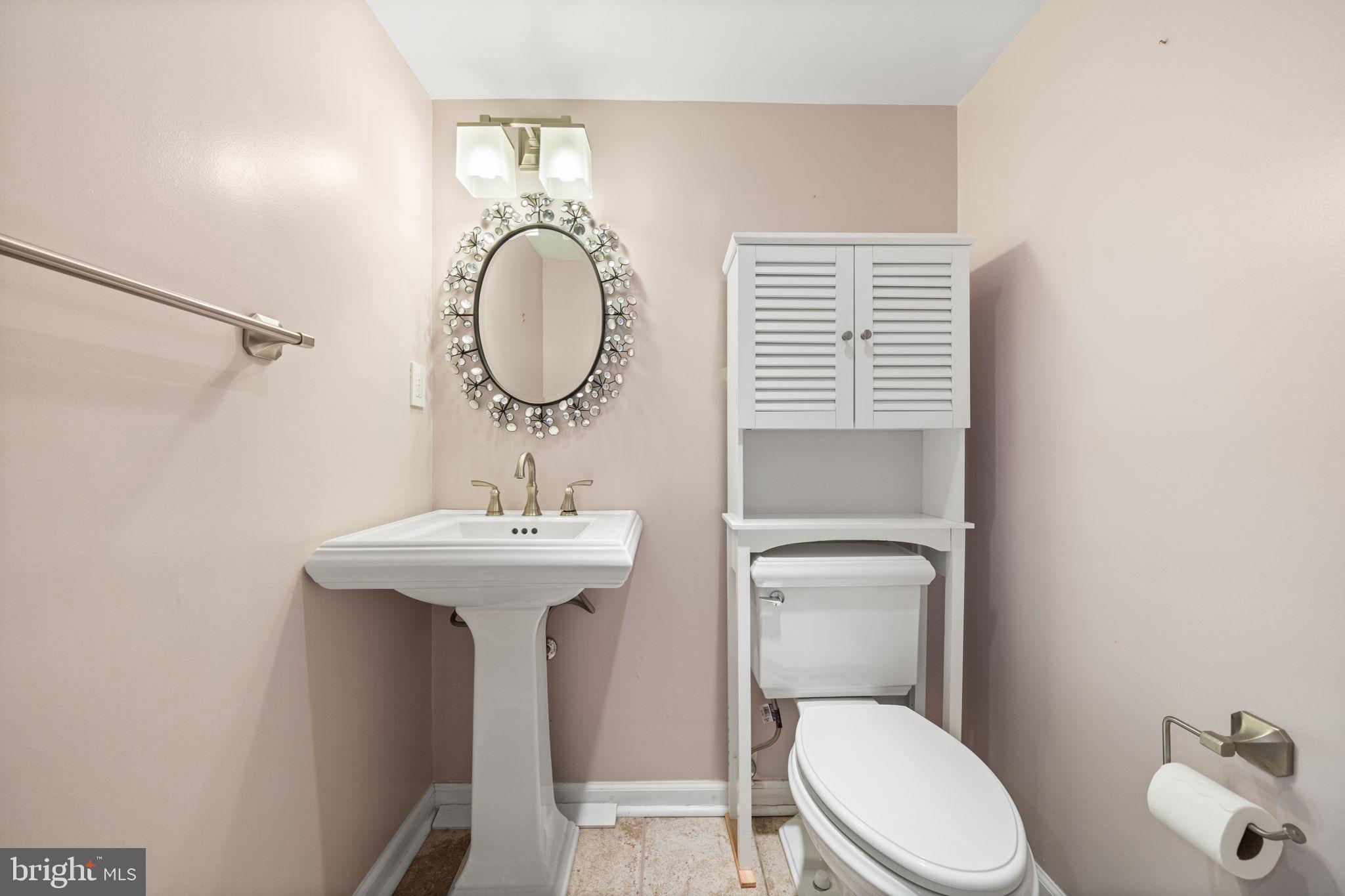 3924 Taney Avenue Alexandria, VA 22304 - Photo 40 of 57 a bathroom with a toilet a sink and mirror
