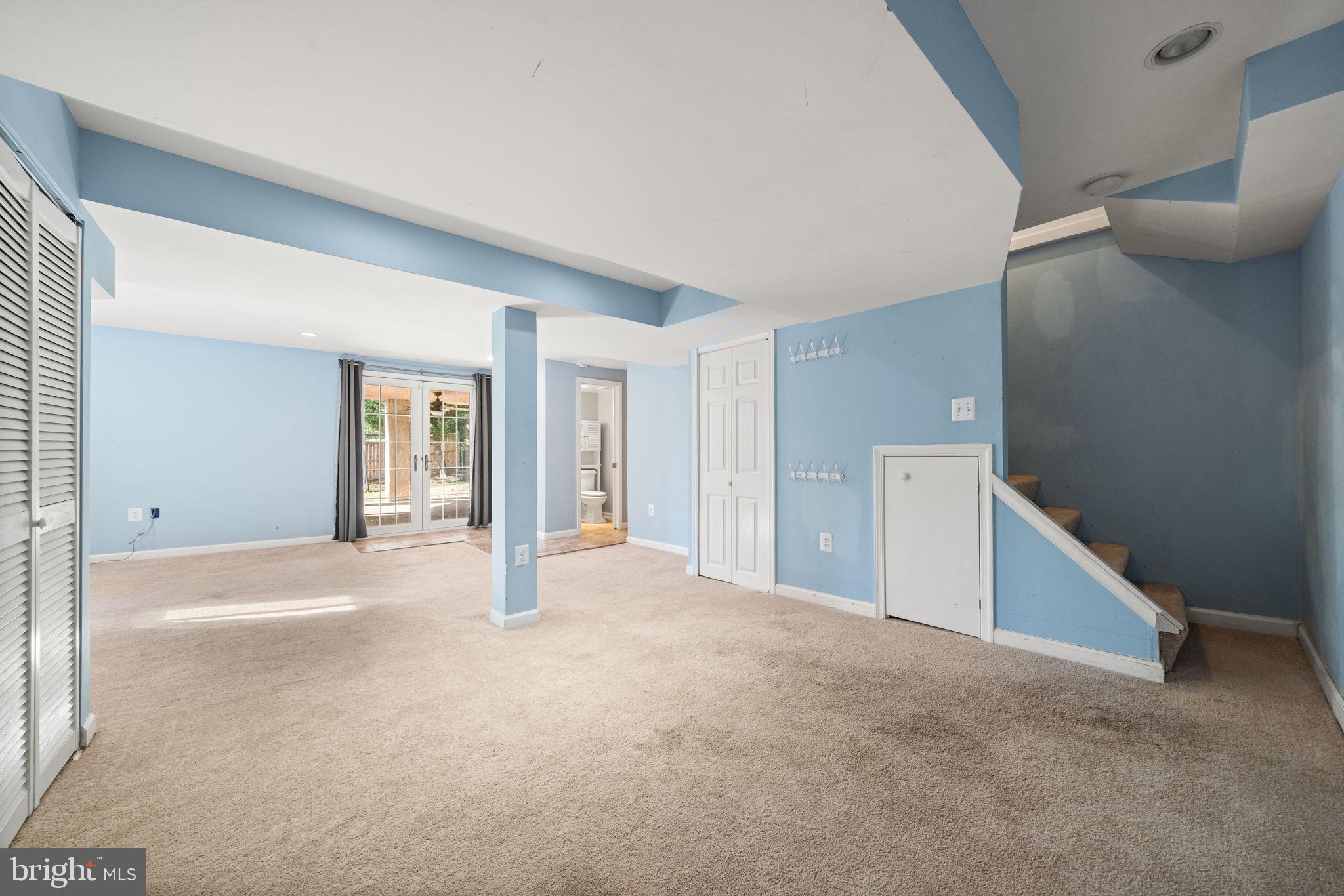 3924 Taney Avenue Alexandria, VA 22304 - Photo 42 of 57 a view of an empty room with wooden floor and cabinet