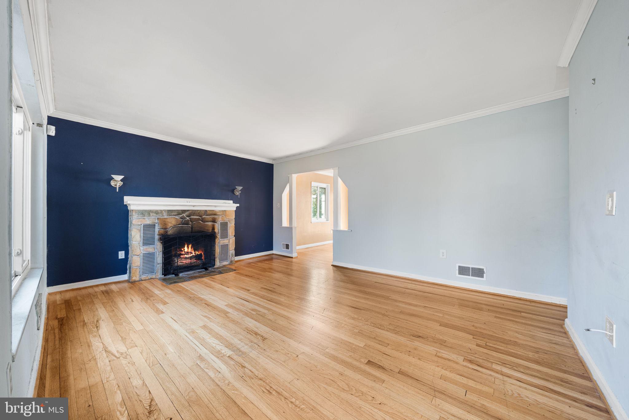 3924 Taney Avenue Alexandria, VA 22304 - Photo 5 of 57 a view of an empty room with window and fire place