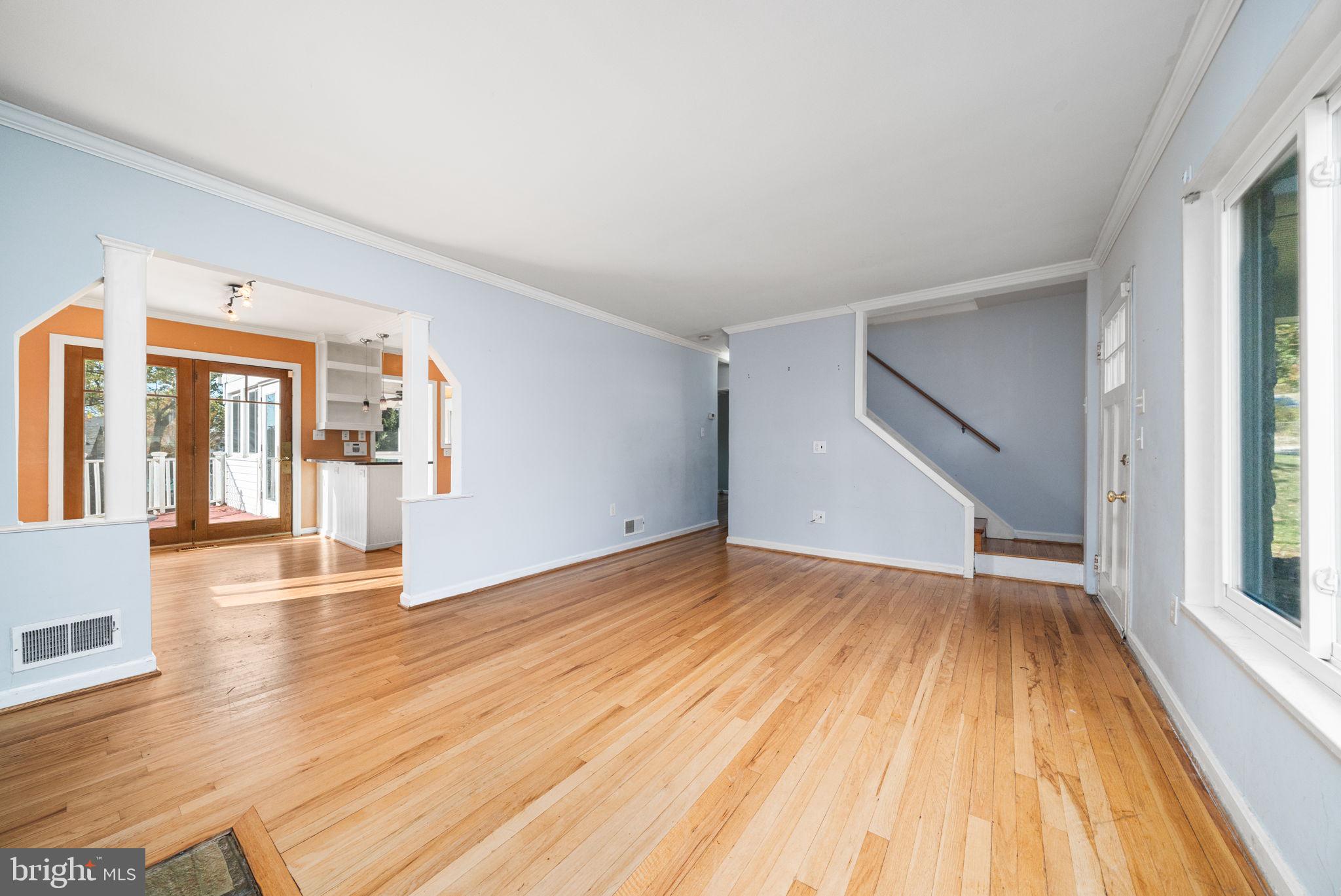 3924 Taney Avenue Alexandria, VA 22304 - Photo 8 of 57 a view of empty room with wooden floor and fan