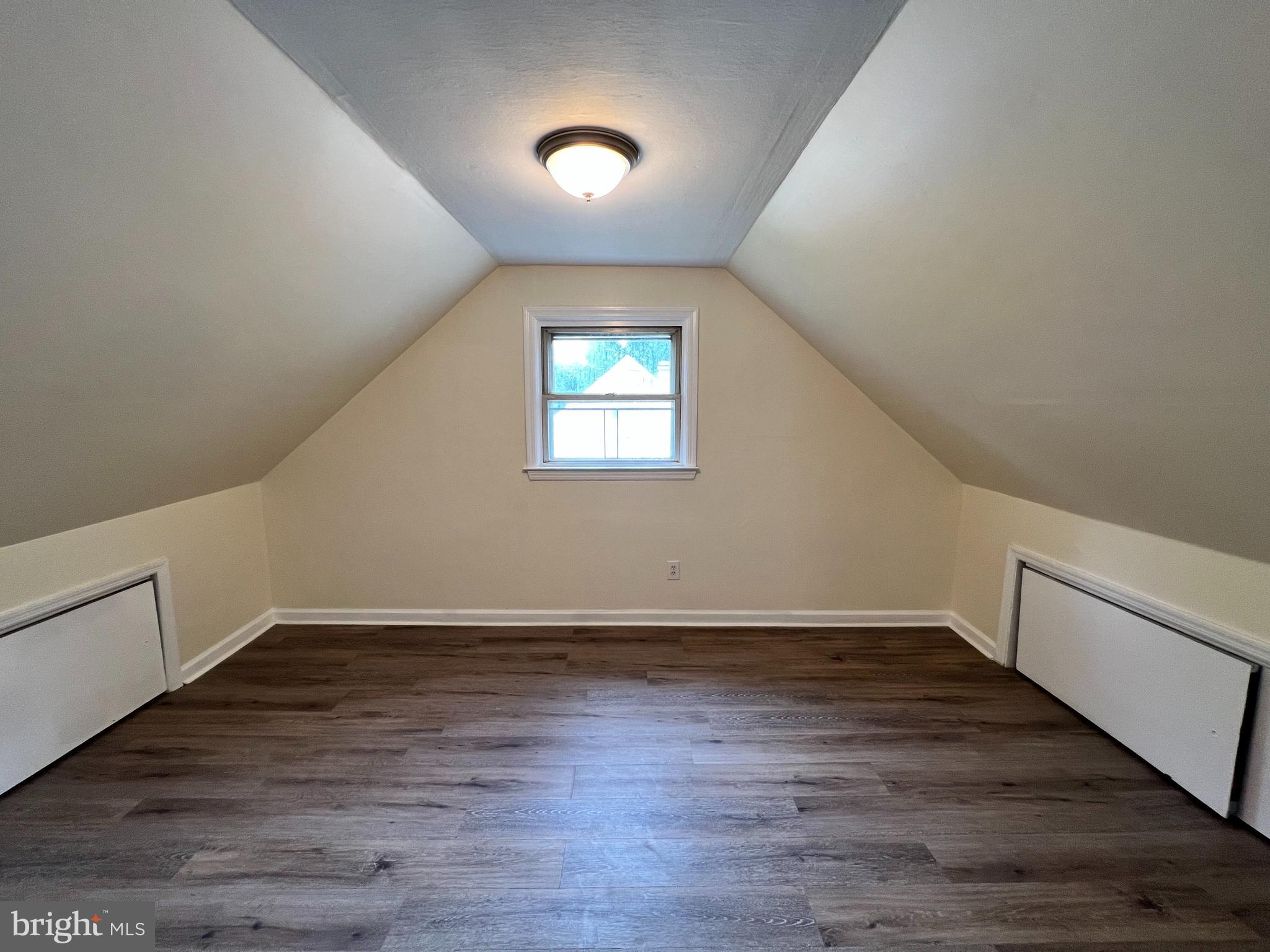 1008 Terrace Boulevard Trenton, NJ 08618 - Photo 13 of 18 an empty room with wooden floor and windows